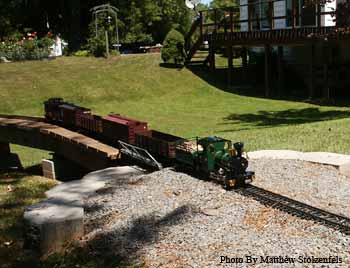 a foreign 0-6-0 pulls a freight train