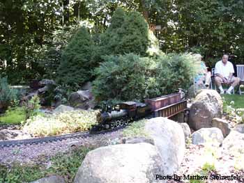 a 2-8-0 crosses a bridge at Tom's