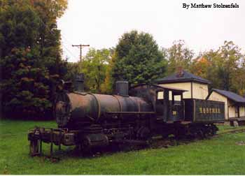 next to a water tower and station